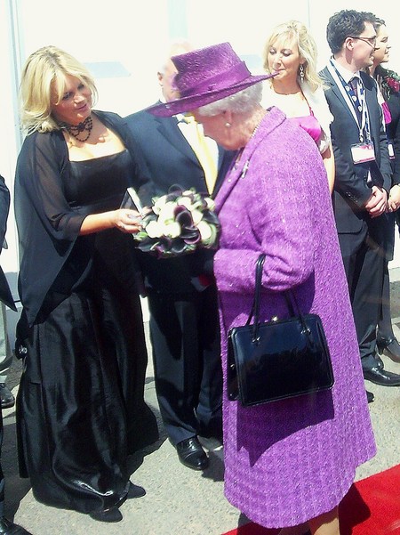 Joy presents the Queen with the latest CD